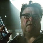 John Goodman with pistol