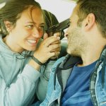 Girl holding guy at gunpoint