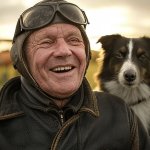 old elderly pilot dog laughing