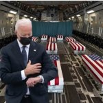 Joe Biden checks his watch