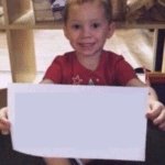 Gavin holding a paper