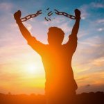 Man breaking chains