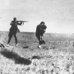 Nazi murdering Jewish woman and child