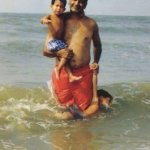 Dad holding two children and one is drowning