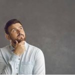 Man infront of board