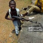 little kid with gun