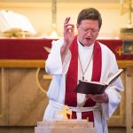 Priest offering blessing
