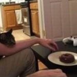I'm physicly resstraing him from eating my doughnut.