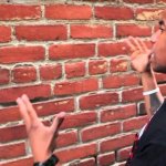Guy talking to brick wall