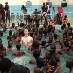 white guy in pool with blacks