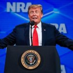 Trump arms out