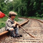 Homeless kid on train track