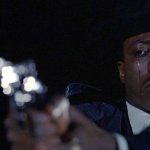 Crying man with gun wide