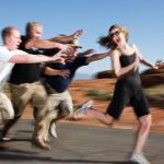 men chase woman