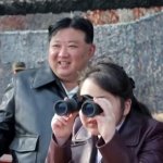 Kim Ju Ae and Kim Jong Un looking at things