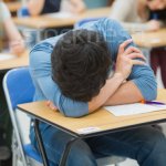 Boy sleeping on desk