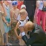 Putin Pedo kissing kid belly