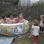 Pool full of adultes w kids on the side