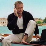 James Bond with a laptop on a yacht in Italy