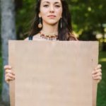Girl holding sign