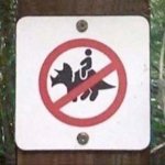 No triceratops riding sign