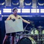 Mario Duplantier with a sign