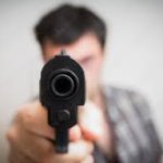 Man pointing pistol