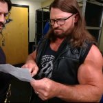 AJ Styles reading paper