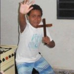 Kid Crying with a Cross