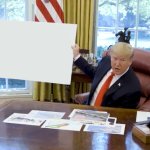 Trump holding large paper sign