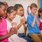 children praying Jesus God