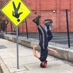 Man Upside Down Road Sign Yellow
