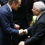 Polish men DT and JK shaking hands