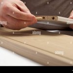 Furniture assembly: installing dowel Stock Photo - Alamy