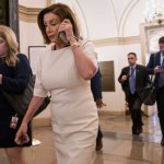 Nancy Pelosi on the phone with somebody