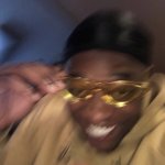 black guy with glasses smiling