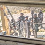 SWAT team uses ladder