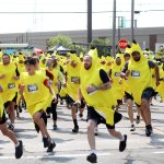 crowd of people wearing yellow
