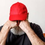sad man red hat