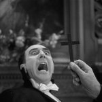 Holding a crucifix to a vampire