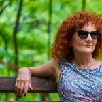 Mature Woman Redhead Bench Sunglasses