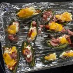 Jalapeño poppers with slices of ham, cream and Colby Jack cheese