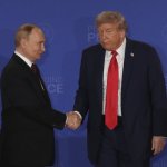 trump and putin shake hands