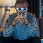 Man eating pizza with 3d glasses