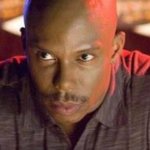 Black man gazing suspiciously
