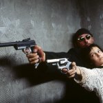 Leon the Professional (Jean Reno) with Natalie Portman both arme