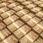 hundreds and hundreds of Canadian dollars stacked up