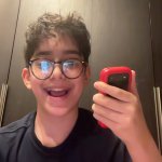 Kid Holding Flip Phone Happy