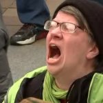 anti trump protester scream green vest