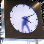 Guy fixing 4PM clock
